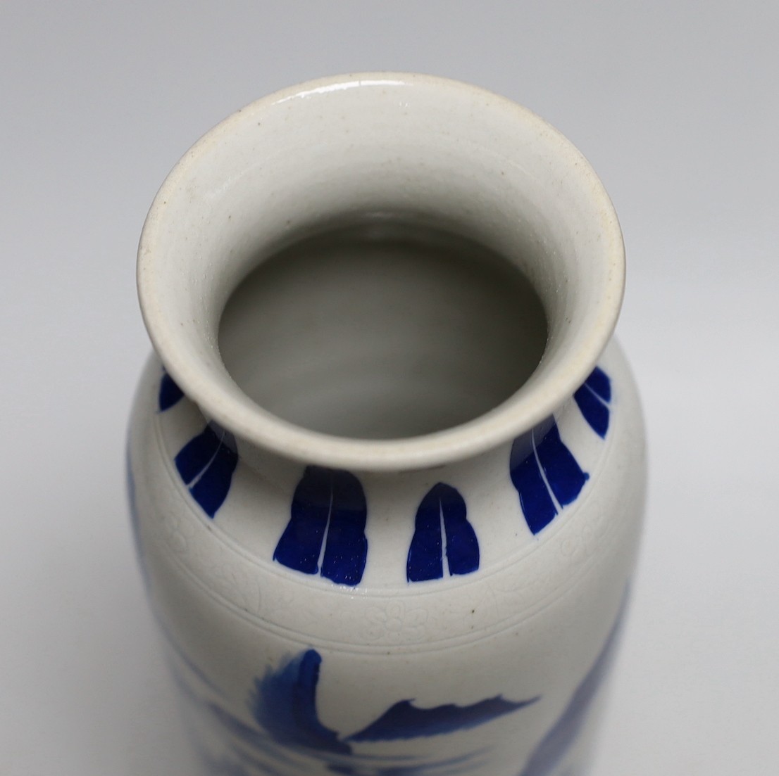 A Chinese blue and white sleeve vase. 26cm tall